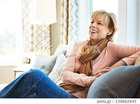 Thinking, laugh or mature woman on couch to relax with freedom on living room sofa at home. Funny joke, happy or senior person with smile, peace or wellness in retirement, lounge or house for resting Thinking, laugh or mature woman on couch to relax with freedom on living room sofa at home. Funny joke, happy or senior person with smile, peace or wellness in retirement, lounge or house for resting 138682645