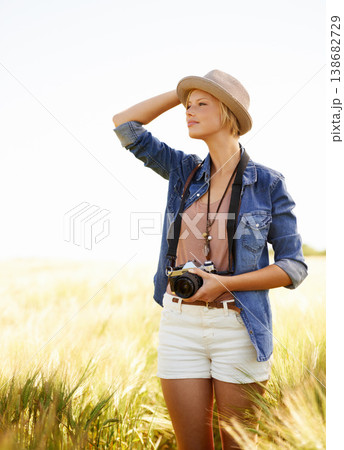 Field, photographer and woman with a camera, ideas and thinking with nature, travel and memory. Person, countryside and girl with photography, outdoor and journey with sunshine, vacation or adventure Field, photographer and woman with a camera, ideas and thinking with nature, travel and memory. Person, countryside and girl with photography, outdoor and journey with sunshine, vacation or adventure 138682729