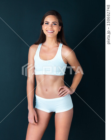 Happy woman, portrait and fitness to lose weight, health and wellness against a studio background. Active female person smile with hand on hip for body workout, exercise or training on mockup space 138682748