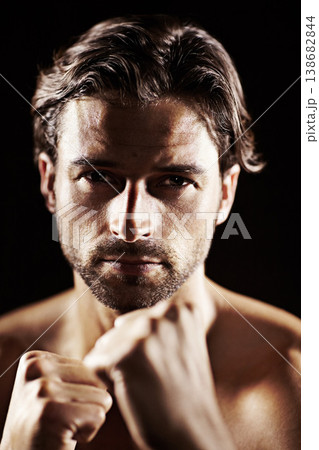 Portrait, man and fist of serious boxer in studio isolated on a black background. Face, boxing and confidence of topless athlete ready for fight, exercise training or workout, sport or combat fitness Portrait, man and fist of serious boxer in studio isolated on a black background. Face, boxing and confidence of topless athlete ready for fight, exercise training or workout, sport or combat fitness 138682844