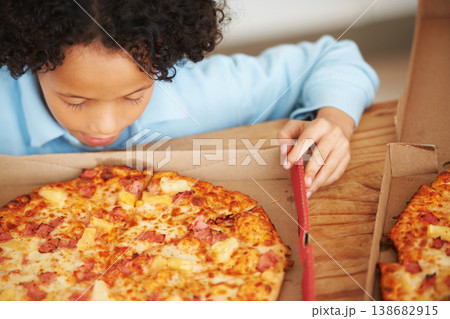 Child, boy and pizza takeaway box for hungry snack, junk fast food dinner at kitchen table. Male person, kid and hawaiian pineapple bacon meal or joy reward eating or unhealthy diet, carbs for lunch Child, boy and pizza takeaway box for hungry snack, junk fast food dinner at kitchen table. Male person, kid and hawaiian pineapple bacon meal or joy reward eating or unhealthy diet, carbs for lunch 138682915