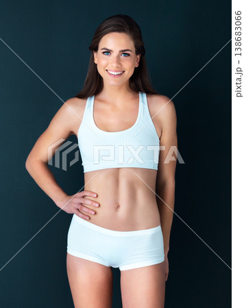 Happy woman, portrait and fitness to lose weight, wellness and health against a studio background. Active female person smile with hand on hip for body workout, exercise or training on mockup space Happy woman, portrait and fitness to lose weight, wellness and health against a studio background. Active female person smile with hand on hip for body workout, exercise or training on mockup space 138683066
