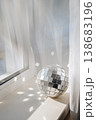 Disco ball reflecting sunlight in interior, light reflections and party atmosphere concept 138683196