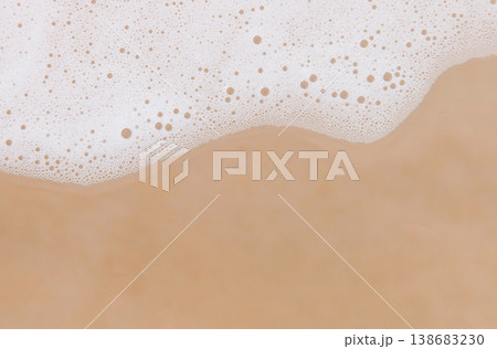 Fluffy white foam texture on beige background, cosmetic or cleaning product concept Fluffy white foam texture on beige background, cosmetic or cleaning product concept 138683230