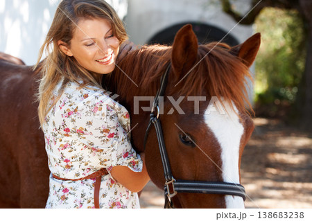Happy, love and young woman with her horse on an outdoor farm for sports racing. Smile, training and confident female person from Canada with her equestrian animal or pet in countryside ranch. Happy, love and young woman with her horse on an outdoor farm for sports racing. Smile, training and confident female person from Canada with her equestrian animal or pet in countryside ranch. 138683238