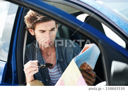 Reading, map and man in a car for travel, journey and lost driver on a road trip and adventure. Check, location and person with transportation to explore the world, countryside or direction to city Reading, map and man in a car for travel, journey and lost driver on a road trip and adventure. Check, location and person with transportation to explore the world, countryside or direction to city 138683530
