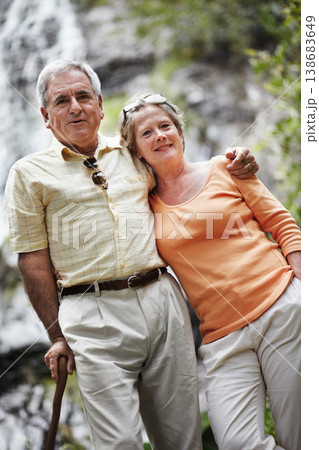 Elderly, man and woman with portrait by mountain for travel, sightseeing or holiday with happiness. Senior, couple and face with smile for cascade, vacation and adventure on retirement or tourism Elderly, man and woman with portrait by mountain for travel, sightseeing or holiday with happiness. Senior, couple and face with smile for cascade, vacation and adventure on retirement or tourism 138683649