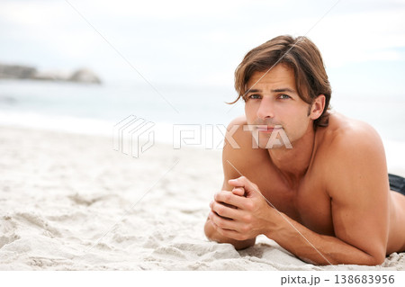 Man, beach and sand for relax stomach for vacation sunshine holiday, summer break or tropical travel. Male person, topless and ocean fresh breeze for happy outdoor weekend, swimwear rest or sea water Man, beach and sand for relax stomach for vacation sunshine holiday, summer break or tropical travel. Male person, topless and ocean fresh breeze for happy outdoor weekend, swimwear rest or sea water 138683956