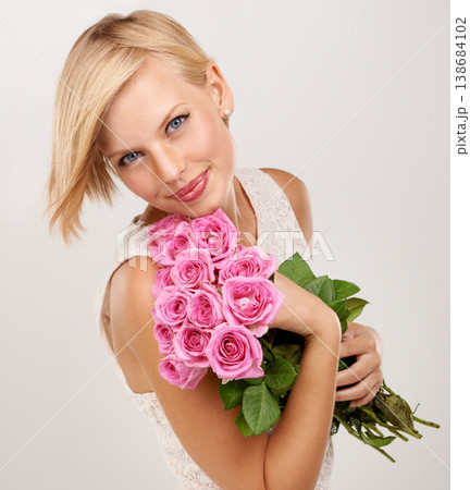 Rose, bouquet and smile with portrait of woman in studio for floral, young and romance. Plants, gift and happy with female person and flowers on white background for elegant, love and present Rose, bouquet and smile with portrait of woman in studio for floral, young and romance. Plants, gift and happy with female person and flowers on white background for elegant, love and present 138684102