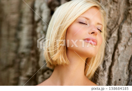Face, tree and woman relax in nature with eyes closed, peaceful and freedom outdoor. Resting, quiet and calm female person in a park with inner peace, fresh air and break in the woods on the weekend Face, tree and woman relax in nature with eyes closed, peaceful and freedom outdoor. Resting, quiet and calm female person in a park with inner peace, fresh air and break in the woods on the weekend 138684185