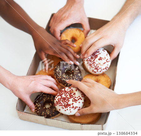 Donut, box and hands of people with delivery of food in office, meeting or white background in studio. Hungry, group and employees eating doughnuts for snack break in company and workplace mockup 138684334