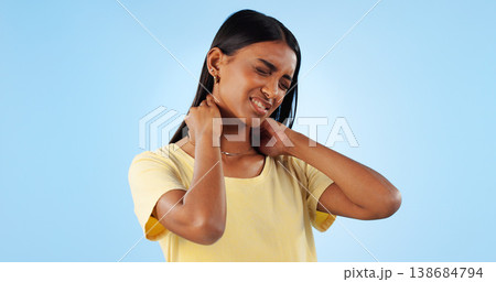 Neck pain, health and woman in studio with spine issue, emergency and bad posture on blue background. Muscle, pressure and fibromyalgia, sick with burnout and injury, mockup space and inflammation 138684794