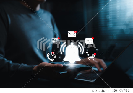 Digital notification concept. Person holding smartphone with floating icons for email, call, calendar, message, and shopping. Ideal for representing online alerts, social media, and mobile apps. Digital notification concept. Person holding smartphone with floating icons for email, call, calendar, message, and shopping. Ideal for representing online alerts, social media, and mobile apps. 138685797