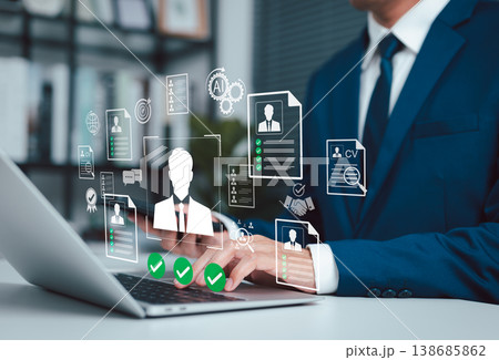 AI Recruitment and Resume Screening for Smart Hiring Process. HR professional using laptop with virtual resume, CV screening, candidate selection, interview, verification and talent acquisition. 138685862