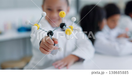 Child, molecular structure and education, learning science or knowledge in classroom or school laboratory. Student kid portrait with atom or molecule model for scientist, project and happy physics 138685885