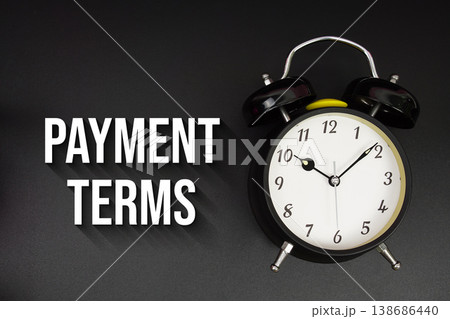 Payment Terms text with alarm clock on black background 138686440