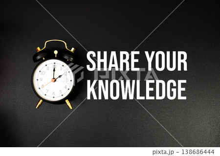 Share Your Knowledge text with alarm clock on black background 138686444