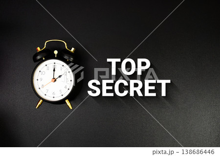 Top Secret text with alarm clock on black background Top Secret text with alarm clock on black background 138686446