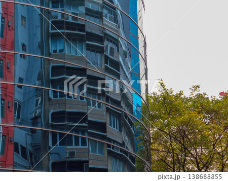 Reflection of business buildings on modern office building wall.Details of modern architecture. Building abstract.   138688855