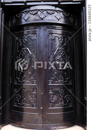 Fragment of antique Iron steel door England, Central Hong Kong. Old city background, retro style. Fragment of antique Iron steel door England, Central Hong Kong. Old city background, retro style. 138689125