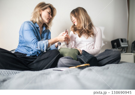 Women sharing beauty routine for a daily makeup preparation Women sharing beauty routine for a daily makeup preparation 138690945