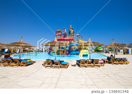 swimming pool with coconut tree and white umbrella swimming pool with coconut tree and white umbrella 138691348