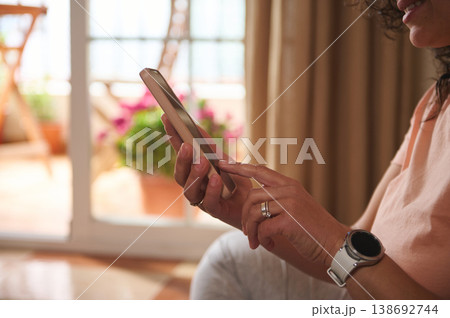 Close up of woman hands using smartphone at home Close up of woman hands using smartphone at home 138692744