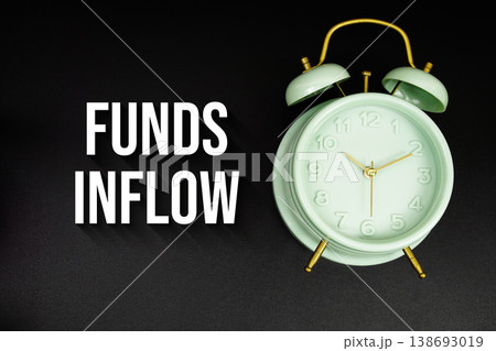 Funds Inflow text with alarm clock on black background 138693019