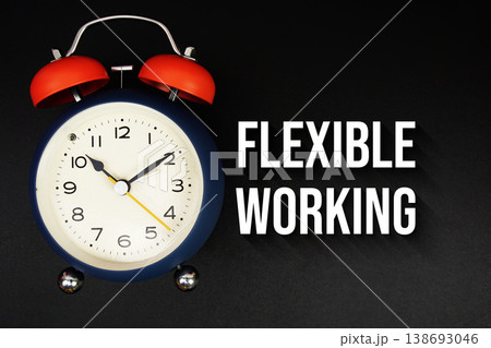 Flexible Working text with alarm clock on black background Flexible Working text with alarm clock on black background 138693046