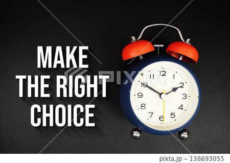 Make The Right Choice text with alarm clock on black background Make The Right Choice text with alarm clock on black background 138693055