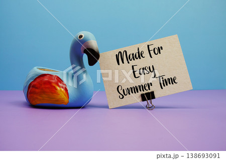 Made For Easy Summer Time text with flamingo  figure on blue and purple background 138693091
