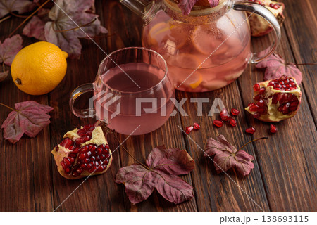 Autumn Pomegranate Tea with Lemon and Ginger on Rustic Table Autumn Pomegranate Tea with Lemon and Ginger on Rustic Table 138693115
