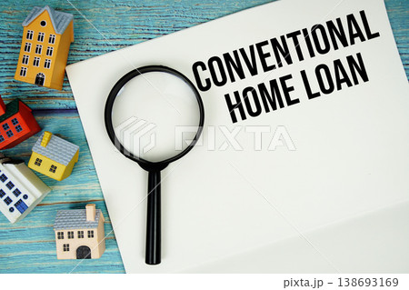 Notepad with "Conventional Home Loan" with magnifying glass and house model on wooden background 138693169
