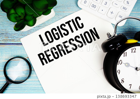Logistic Regression written on paper placed on a blue wooden surface, alongside a magnifying glass, a clock, a calculator, and a small plant Logistic Regression written on paper placed on a blue wooden surface, alongside a magnifying glass, a clock, a calculator, and a small plant 138693347