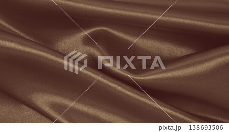Smooth elegant brown silk or satin luxury cloth texture as abstract background. Luxurious background design.  In Sepia toned. Retro style 138693506