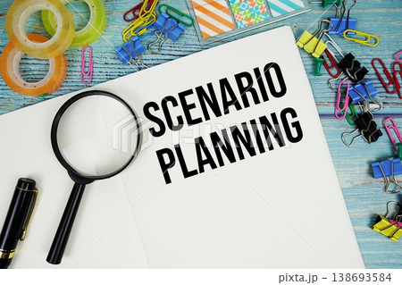 Scenario Planning text written on notepad with magnifying glass flat lay on wooden background Scenario Planning text written on notepad with magnifying glass flat lay on wooden background 138693584