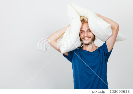 Man playing with pillows, good sleep concept Man playing with pillows, good sleep concept 138693638