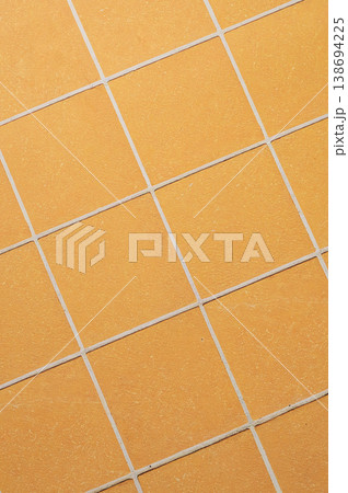 Orange ceramic tile background in a minimalist style. Interior design concept. 138694225