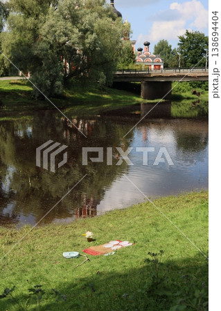 Idyllic summer scene featuring outdoor dining and serene waterways Idyllic summer scene featuring outdoor dining and serene waterways 138694404