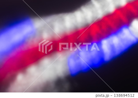 Vibrant abstract photo of red, blue and white blurred lights Vibrant abstract photo of red, blue and white blurred lights 138694512