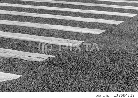 Monochrome closeup of a zebra crossing crosswalk, abstract 138694518