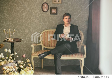 Man of European descent studies financial reports attentively 138694545