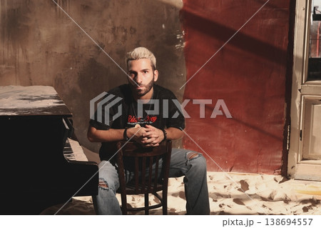 Intimate and candid shot capturing musician with retro ambiance Intimate and candid shot capturing musician with retro ambiance 138694557