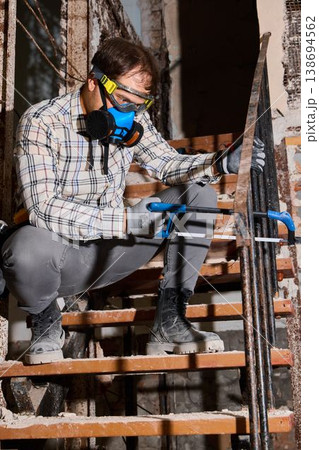 Professional evaluation of stair components and corrosion damage 138694562