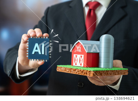 A businessman presents innovations in the implementation of AI in the agricultural industry. Artificial intelligence technology in farming improves efficiency, automation and crop management systems. 138694621