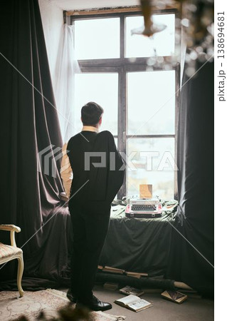 Elegant study with old typewriter and scattered papers around Elegant study with old typewriter and scattered papers around 138694681