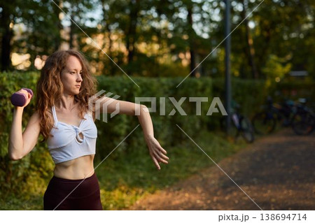 Caucasian pilates enthusiast practicing coordinated arm control Caucasian pilates enthusiast practicing coordinated arm control 138694714
