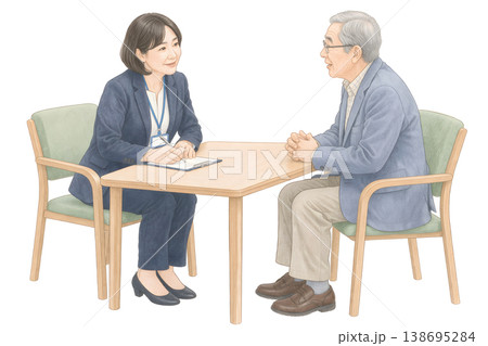 高齢者と相談員が向き合って話す安心感のあるカウンセリングシーン 138695284