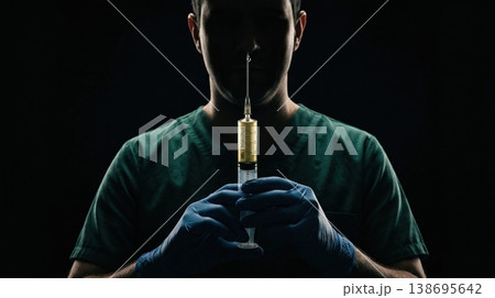 Urgent medical procedure, physician's gloved hands prepare vital drug, emphasizing patient safety. Healthcare. 138695642