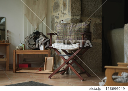 Cozy wooden chair in rustic interior warm home decor scene Cozy wooden chair in rustic interior warm home decor scene 138696049